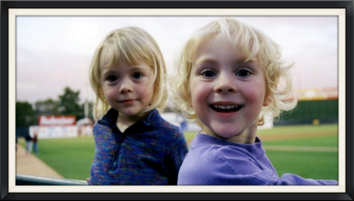 Two kids at a sports field